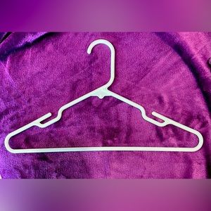 100 adult plastic clothes hangers.